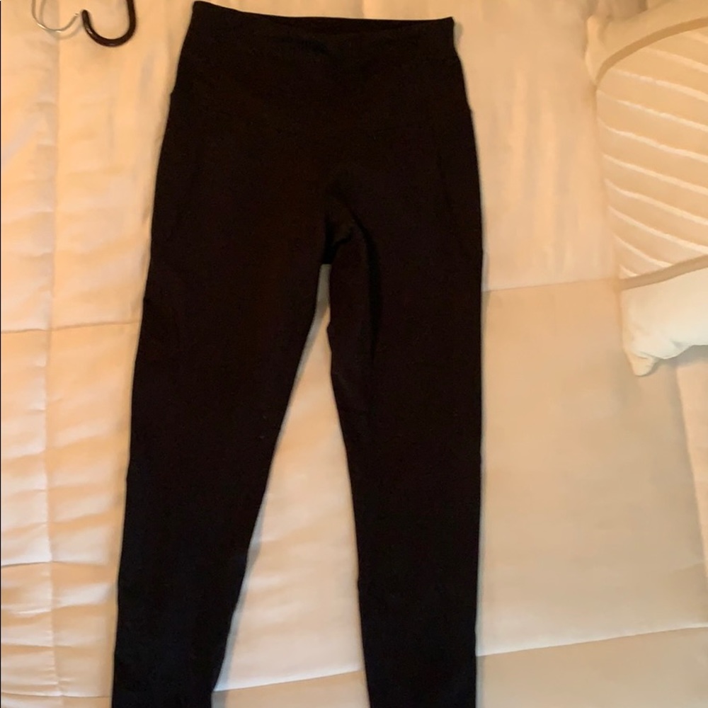 Black Zella leggings with criss cross cut outs